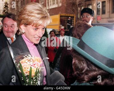 Diana Princess of Wales receives flowers from a well-wisher as she leaves the Carlyle Hotel in New York, this afternoon (Tuesday). The Princess was in the city to attend the Costume Institute ball last night at the Metropolitan Museum of Art. Photo by John Stillwell/PA. Stock Photo