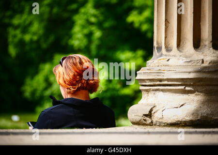 In Spring People enjoy freetime in Nymphenburg Park Munich Germany Europe Stock Photo