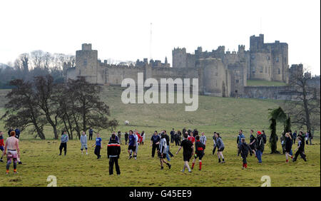 RETRANSMITTED CORRECTING BYLINE TO OWEN HUMPHREYS. People enjoy the traditional Shrove Tuesday Football match at Alnwick Castle in Northumberland. Stock Photo