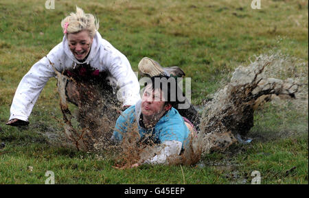 RETRANSMITTED CORRECTING BYLINE TO OWEN HUMPHREYS. People fall over while participating in the traditional Shrove Tuesday Football match at Alnwick Castle in Northumberland. Stock Photo