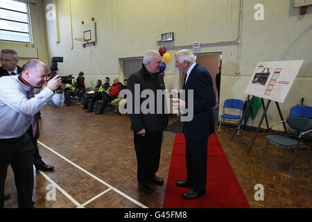 Irish Olympian Athlete Ronnie Delaney (right) speaks with former Taoiseach Bertie Ahern (left) at O'Connell Secondary School, North Richmond street, Dublin where he opened a floodlit all-weather sports facility at his old school. Stock Photo