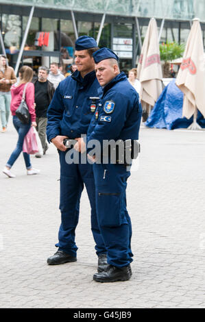 Two police officers in Váci UTC (Váci street), a popular street for tourists and  is one of the main pedestrian thoroughfares i Stock Photo