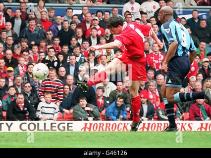 Liverpool's Robbie Fowler blast home the reds' only goal against Coventry at Anfield this afternoon (Sunday). Liverpoll lost the match, meaning they're hopes to top the Premier League were dashed for this week. Photo by Dave Kendall/PA. Stock Photo
