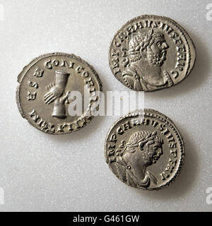 Three of 52,503 coins found in the Frome hoard by metal detectorist Dave Crisp, which are Roman silver Denarius, dated 286-93AD. Stock Photo