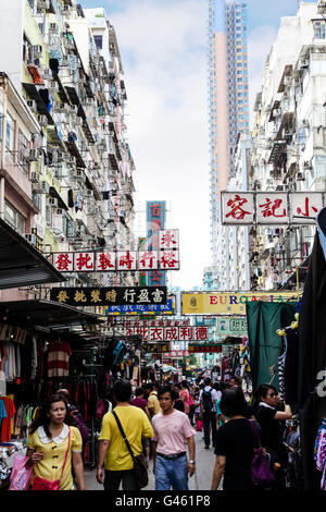 Hong Kong - August 7, 2013: Busy shoppers stroll along Sham Shui Po street market Stock Photo