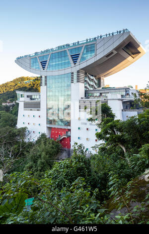 HONG KONG - August 4, 2013: View of the Peak Tower at 428 meters above sea level in Hong Kong atop Victoria Peak. Stock Photo