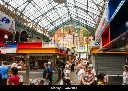 Interior of Atarazanas, covered Market with closed vendor kiosks in Malaga, Andalusia, Spain.