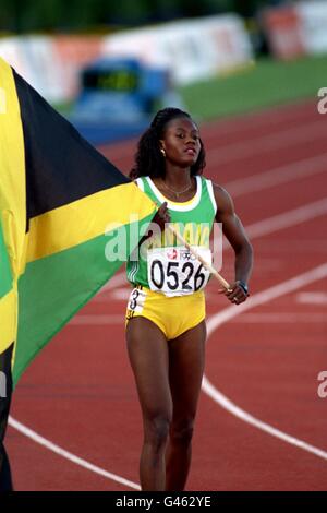 200m women final; MERLENE OTTEY, JAMACIA. GOLD MEDALIST with flag. Stock Photo