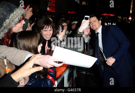 Channing Tatum poses for photographs with fans as he arrives for the UK Premiere of The Eagle, at the Empire Leicester Square, London. Stock Photo