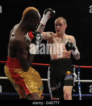 Boxing - Braehead Arena. Ricky burns (right) in action against Joseph Lareya during the WBO Super-Feather bout at the Braehead Arena, Glasgow. Stock Photo