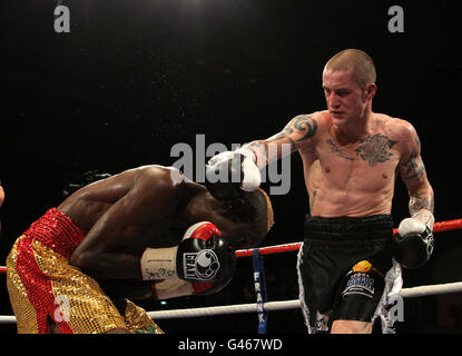 Boxing - Braehead Arena. Ricky Burns (right) in action against Joseph Lareya during the WBO Super-Featherwight bout at the Braehead Arena, Glasgow. Stock Photo