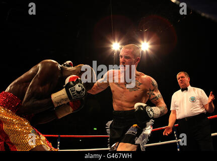 Ricky Burns (right) in action against Joseph Lareya during the WBO Super-Featherwight bout at the Braehead Arena, Glasgow. Stock Photo