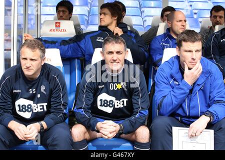 (L-R) Bolton Wanderers assistant manager Sandy Stewart, manager Owen Coyle and first team coach Steve Davis Stock Photo