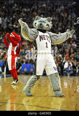 Toronto Raptors mascot The Raptor and New Jerseys Nets mascot Sly the Silver Fox (right) entertain the crowd before the game Stock Photo