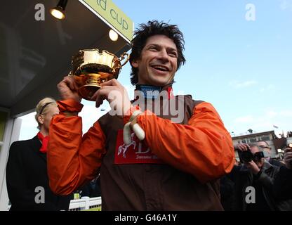 Jockey Sam Waley-Cohen celebrates winning the totesport Cheltenham Gold Cup on Long Run during Gold Cup Day, at the Cheltenham Festival. Stock Photo