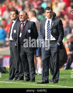 Soccer - UEFA Euro 2012 - Qualifying - Group G - Wales v England - Millennium Stadium. Wales manager Gary Speed (right) and England manager Fabio Capello (left) on the touchline prior to kick-off. Stock Photo