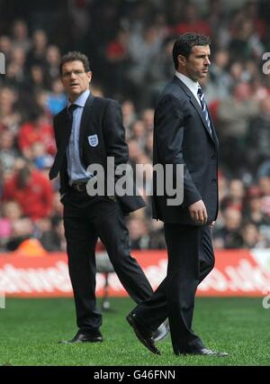 England manager Fabio Capello (left) and Wales manager Gary Speed (right) on the touchline. Stock Photo