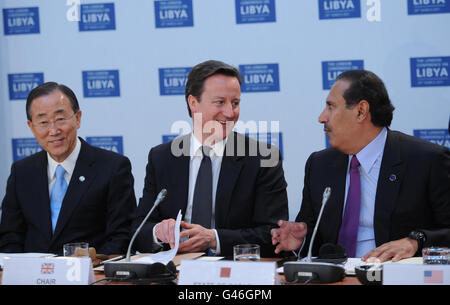 British Prime Minister David Cameron is pictured with Prime Minister and Minister of Foreign Affairs of Qatar His Excellency Sheikh Hamad Bin Jissim Bin Jabr Al Thani (right) and UN Secretary General Ban Ki Moon (left) at the opening meeting of the Libya Conference in London.