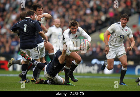 Rugby Union - RBS 6 Nations Championship 2011 - England v Scotland - Twickenham. England's Toby Flood is tackled by Scotland's Richie Gray during the RBS 6 Nations Match at Twickenham, London. Stock Photo