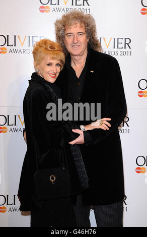 Anita Dobson and Brian May arrive at the 2011 Laurence Olivier Awards at the Theatre Royal in London. Stock Photo