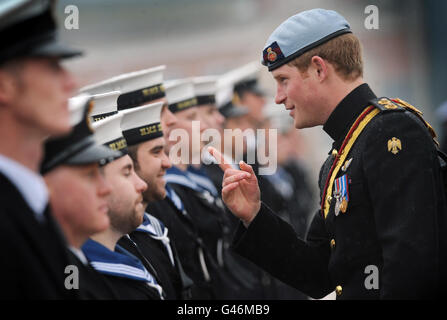 Prince Harry, in his role as Commodore-In-Chief, Small Ships and Diving, presents medals to members of the First and Second Mine Countermeasures Squadrons (MCM1 and MCM2) at Portsmouth Naval Base, Hampshire, to mark their service in Iraq. Stock Photo