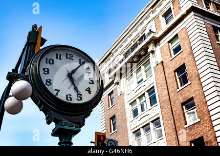 A large street clock in Government street, Vancouver Island, British Columbia. Stock Photo