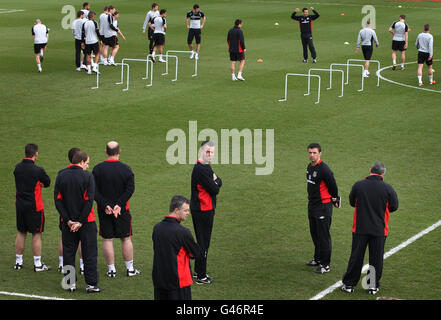 Wales's Manager Gary Speed (second right) watches his players warm up ahead of a training session at the Vale Hotel, Hensol. Stock Photo