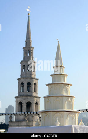 A four foot high medieval wedding cake, which replicates the steeple and spire of St Bride's Church, is seen infront of the St Bride's Church on Fleet Street, London, to celebrate the upcoming royal wedding as part of Visit London's 'Only in London' campaign. Stock Photo