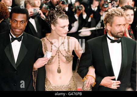 (L/r) Chris Tucker, Milla Jovovich and Director Luc Besson arrive for the premiere of The Fifth Element at the 50th Cannes Film Festival. Stock Photo