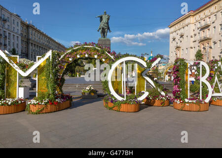 View of the monument to Yury Dolgoruky on Tverskaya Street in Moscow with flowers decoration on summer season festival, Russia Stock Photo