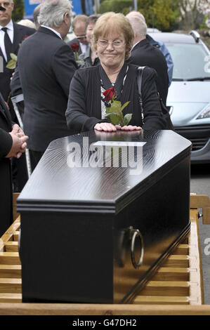 Mary Halliwell stands beside a coffin containing the skeletal remains of her great-great-great grandfather's brother John Horwood, who was hanged for murder 190 years ago on April 13, 1821, at Christ Church Hanham, near Bristol. Stock Photo