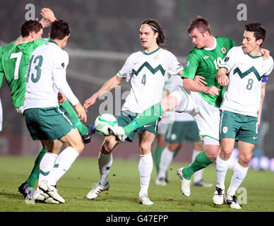 Northern Ireland's Chris Brunt in action with with Slovenia's Bojan Jokic, Marko Suler (centre) and Robert Koren (right) during the International Friendly at Windsor Park, Belfast. Stock Photo