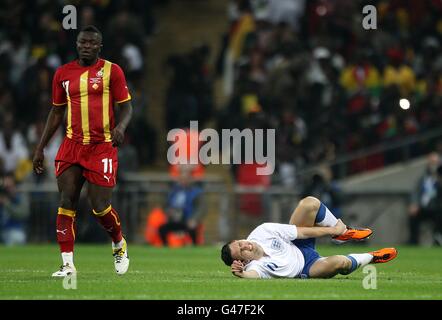 Soccer - International Friendly - England v Ghana - Wembley Stadium. England's Stewart Downing lies injured on the floor Stock Photo