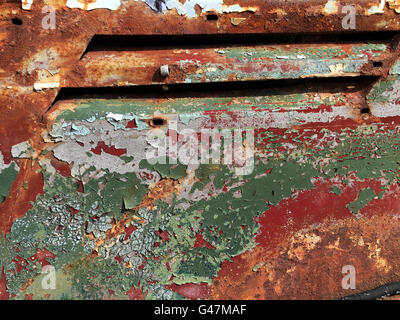 Peeling paint old car door and rusty texture background. Stock Photo