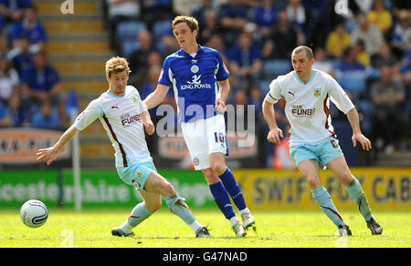 Leicester City's Andy King is closed down by Burnley's Wade Elliott and Dean Marney during the npower Championship match at the Walkers Stadium, Leicester. Stock Photo