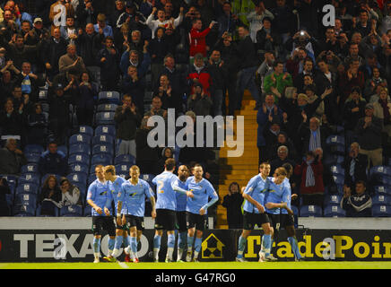 Coventry City fans celebrate Marlon King's second penalty of the night during the npower Championship match at Fratton Park, Portsmouth. Stock Photo