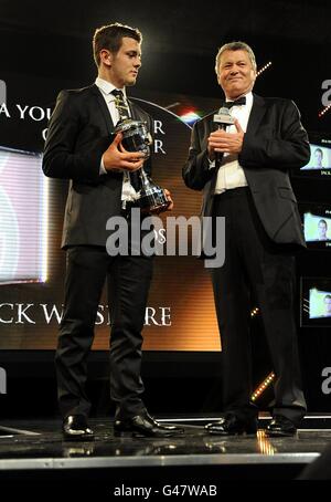 Arsenal's Jack Wilshere (left) is presented with the PFA Young Player of the Year trophy by Sky Sports Presenter George Gavin at the PFA Player of the Year Awards 2011 at the Grosvenor House Hotel Stock Photo