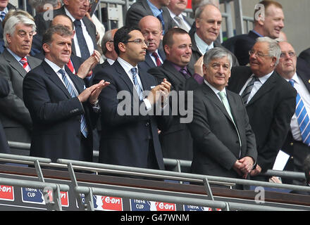 Soccer - FA Cup - Semi Final - Manchester City v Manchester United - Wembley Stadium. Manchester City Chairman Khaldoon Al Mubarak (c) with Chief Executive Garry Cook (l) in the stands Stock Photo