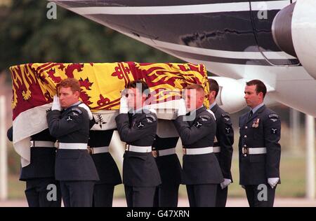 The coffin of Diana, Princess of Wales is carried off a plane of the Royal Squadron by Service Men from the Royal Air Force at RAF Northolt. The Princess and her friend Dodi Fayed were killed in a crash in Paris during the early hours of the morning. Stock Photo