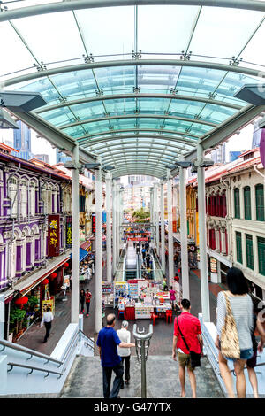 Singapore - December 15, 2014: People strolling along Chinatown's Pagoda Street with its low-rise Victorian style houses. Stock Photo