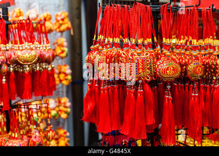 Chinese New Year ornaments on sale in Chinatown. These common ornaments have the Chinese words meaning Blessings and Peace Stock Photo