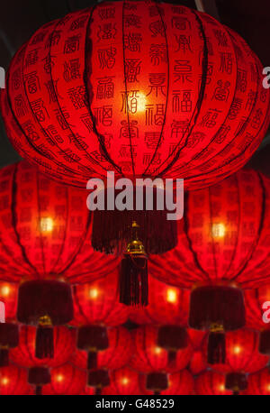 Focus on red chinese lantern with deliberate shallow depth of field on array of background lanterns. Auspicious Chinese symbol o Stock Photo