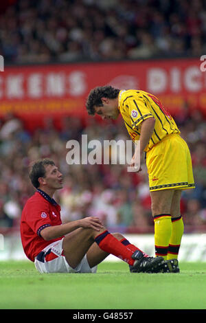 Middlesbrough player-manager Bryan Robson has choice word's for Burnley's John Deary (r) after being fouled during his first game in charge. Stock Photo