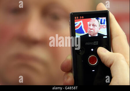 Jim Allister,TUV leader, is recorded by a web journalist as he speaks at the official launch of the Traditional Unionist Voice (TUV) election campaign and manifesto at his office in Holywood Road, Belfast. Stock Photo