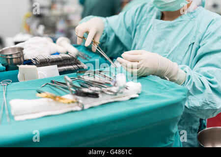 scrub nurse preparing medical instruments for operation Stock Photo - Alamy