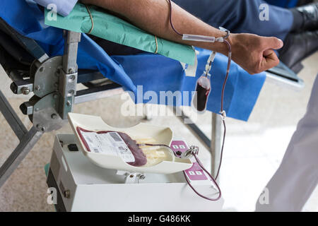 Volunteers are donating blood at the World Blood Donor Day (WBDD). The event serves to raise awareness of the need for safe bloo Stock Photo