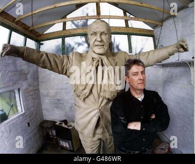 Library filer dated 1/6/97 of the statue of Legendary Liverpool FC manager, Bill Shankly, seen here with its creator, Tom Murphy in his workshop. A 22-inch-high one-off model, which is a replica of the seven-foot-high statue commissioned by the Club's sponsors, Carlsberg, was stolen on Sunday from the studio behind Mr Murphy's home in Aigburth, Liverpool. PA Photo. See PA story CRIME Shankly. Stock Photo