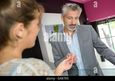 handling over an e-cigarette Stock Photo