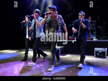 Big Time Rush (from left to right) Logan Henderson, James Maslow, Kendall Schmidt and Carlos Pena, perform on stage at Shepherd's Bush Empire in west London. Stock Photo