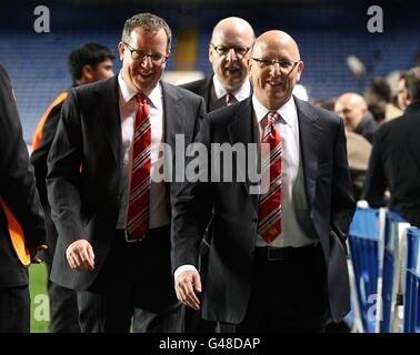 Soccer - UEFA Champions League - Quarter Final - First Leg - Chelsea v Manchester United - Stamford Bridge. Manchester United directors Avram Glazer (centre) and Joel Glazer (right) with their brother Bryan Glazer (left) after the game